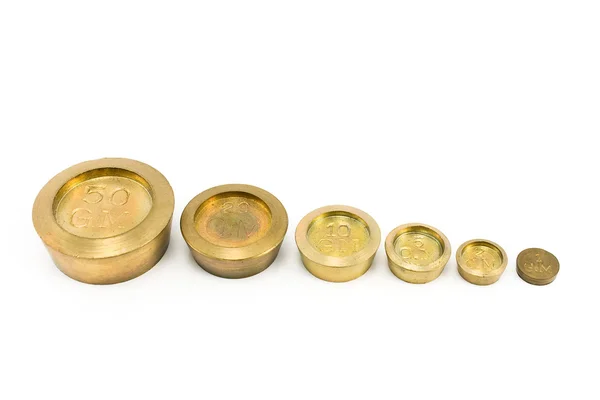 Brass weights of different size — Stock Photo, Image