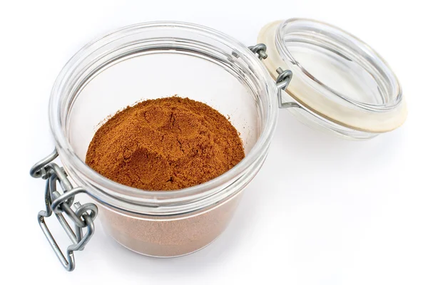 Red pepper powder in open jar — Stock Photo, Image