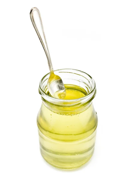 Honig im Glas mit Silberlöffel — Stockfoto