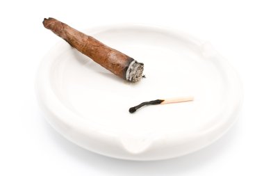 Smoking cigar in an ashtray clipart