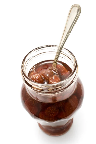Engarrafamento de morango em jarra com colher de prata — Fotografia de Stock