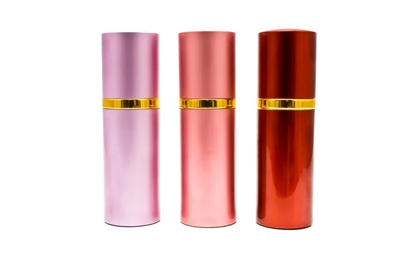 Três latas de spray coloridas — Fotografia de Stock