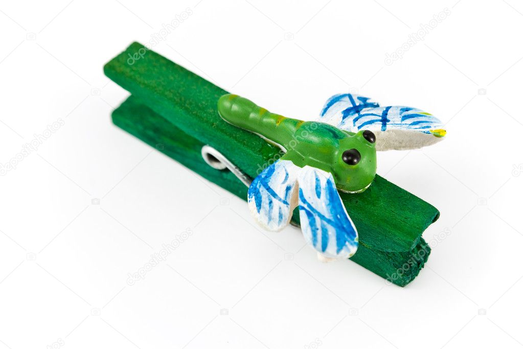 Wooden clothespin decorated with dragonflies