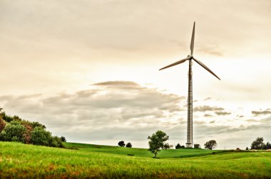 Wind Turbine in spring meadow clipart