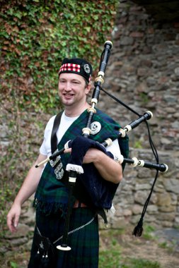 Laughing Bagpiper clipart