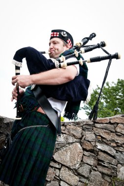 Bagpiper on Stone Steps clipart