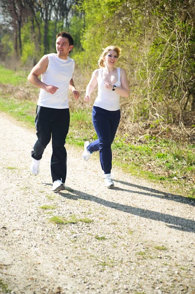 Couple jogging in the nature — Stock Photo, Image