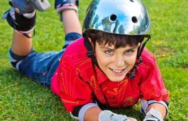 Happy boy in roller blades clipart