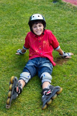 Happy boy in roller blades clipart