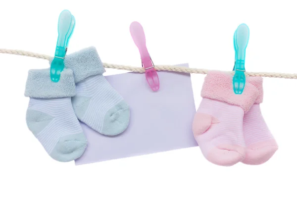 stock image Baby blue and pink socks with blank envelope