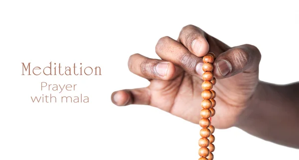 Hand with japa mala beads — Stock Photo, Image