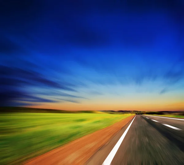 Blured road and blue sky — Stock Photo, Image