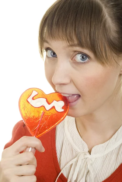 Attractive girl with heart lolly pop — Stock Photo, Image
