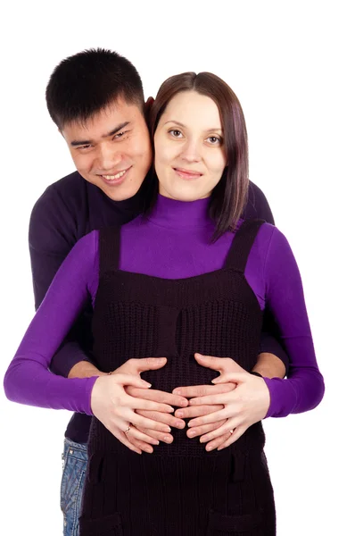 Young happy pregnant couple in love closeup on black background in studio — Stock Photo, Image