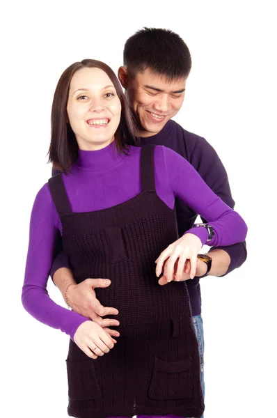 Young happy pregnant couple in love closeup on black background in studio — Stock Photo, Image