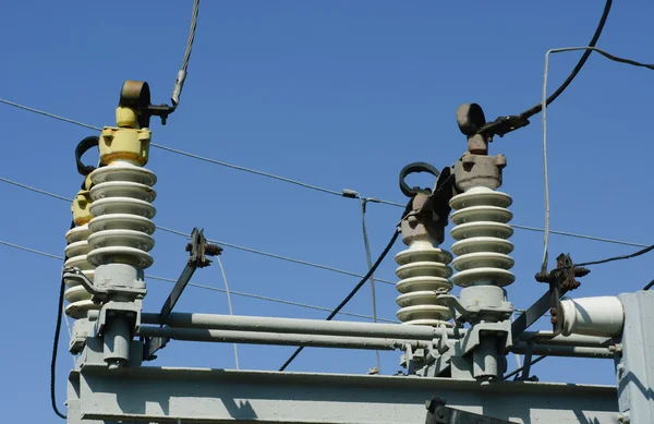 Part of high-voltage substation on the blue sky background — Stock Photo, Image