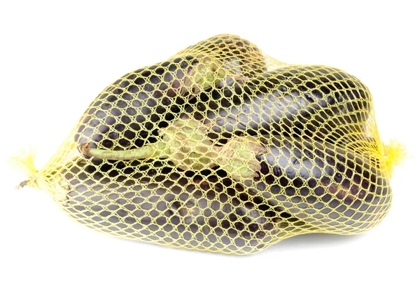 Patlıcan izole beyaz zemin üzerinde bir kılavuzda — Stok fotoğraf