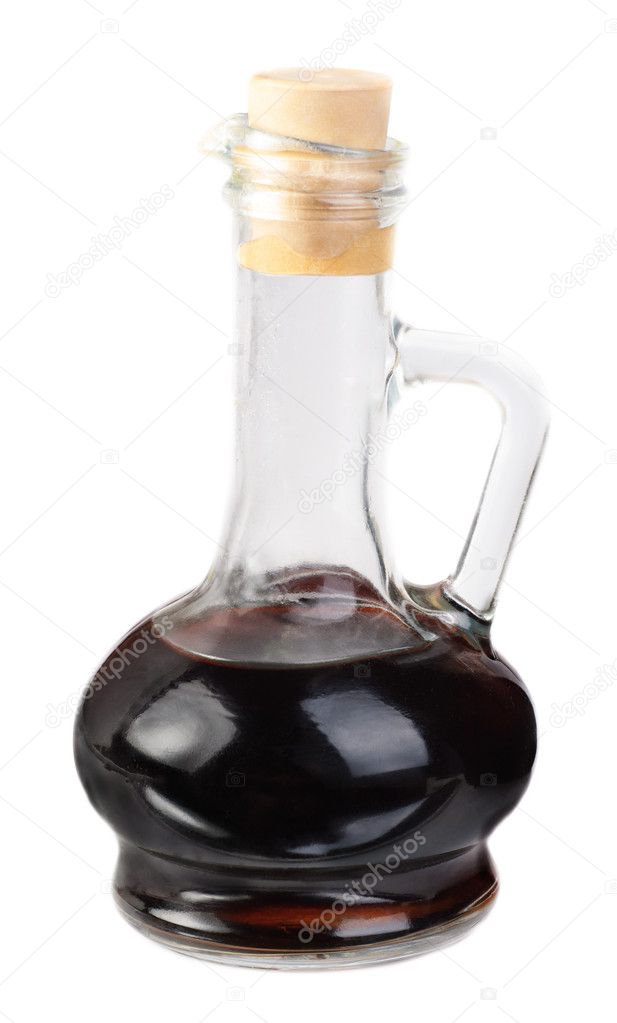 Small decanter with balsamico vinegar isolated on the white background