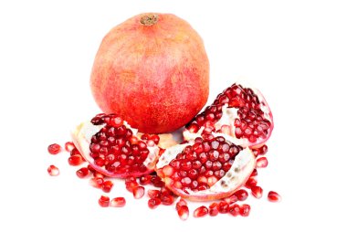 Pomegranate and slice isolated on white background clipart