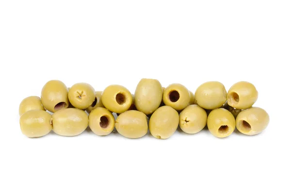 Оливки с косточками на белом фоне — стоковое фото