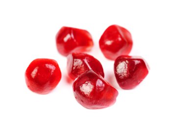 Some garnet seeds isolated on white background clipart