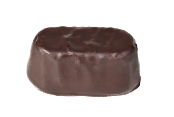 Caramelo en un chocolate sobre un fondo blanco — Foto de Stock