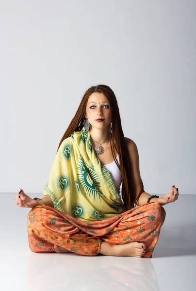 stock image Young indian woman posing sitting on the floor