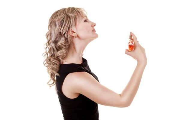 Mujer con perfumes en las manos — Foto de Stock