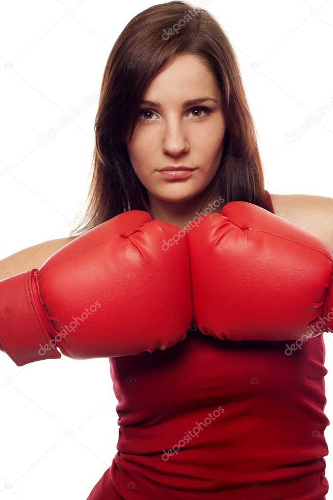Pretty confident woman with boxing gloves