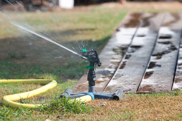 Sprinkler watering grass. — Stock Photo, Image