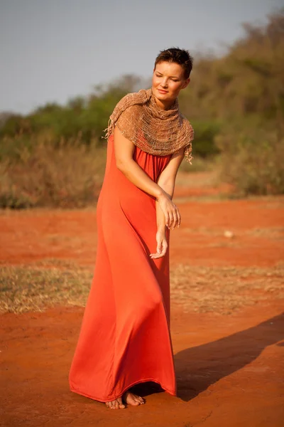Beautiful girl dressed terracotta dress — Stock Photo, Image