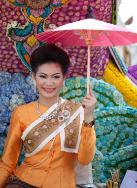 CHIANG MAI, THAILAND - FEBRUARY 4: Traditionally dressed woman o clipart