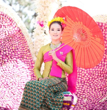 CHIANG MAI, THAILAND - FEBRUARY 4: Traditionally dressed woman i clipart