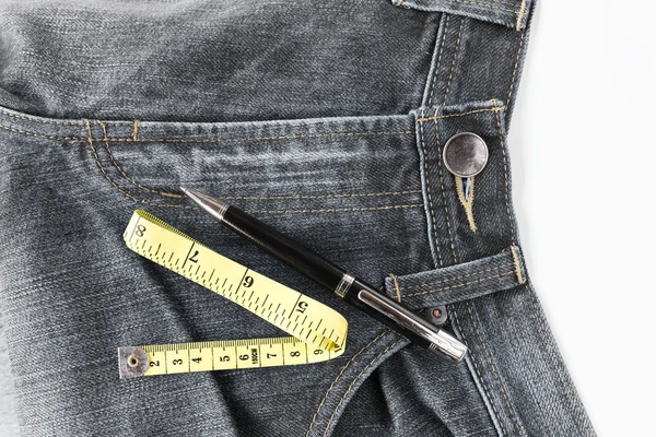 Jeans and measuring tape Stock Photo