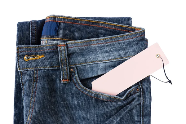 Nové modré džíny kalhoty a tag — Stock fotografie