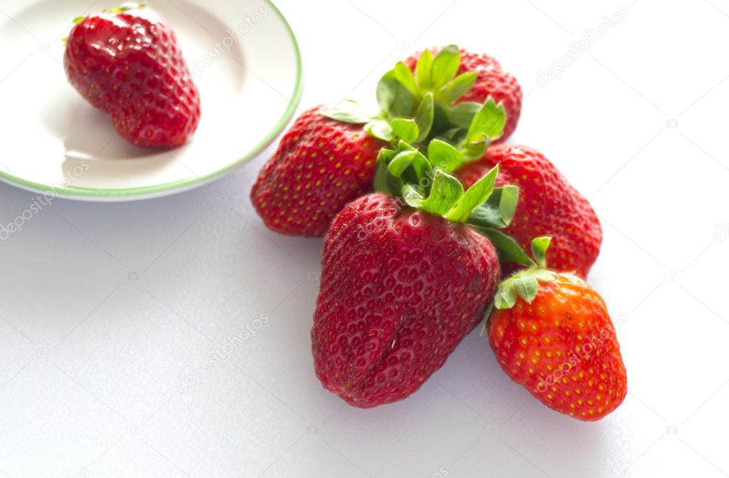 Strawberry and ceramic plate
