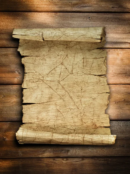 Rolagem de papel antigo vintage em madeira — Fotografia de Stock
