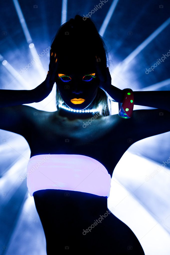 Girl with ultraviolet make-up disco dance