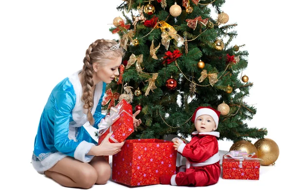 Beauty christmas girl play with baby santa claus — Stock Photo, Image