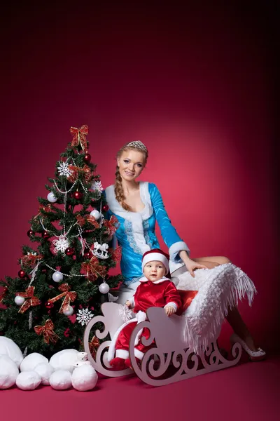 Snow Maiden and baby santa claus portrait — Stock Photo, Image