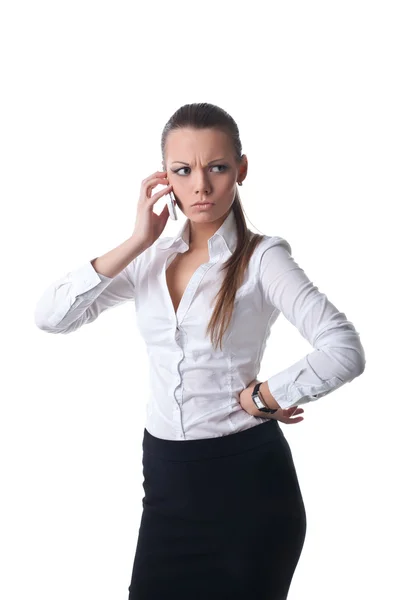 Сексуальная молодая серьезная деловая женщина разговаривает по телефону — стоковое фото