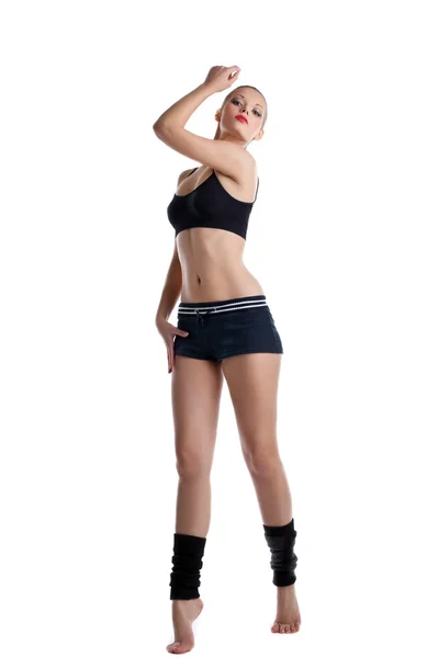 Šťastná mladá žena stojí v cvičební úbor — Stock fotografie