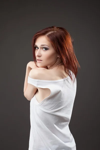 Beautiful sexy young woman undress tank top — Stock Photo, Image