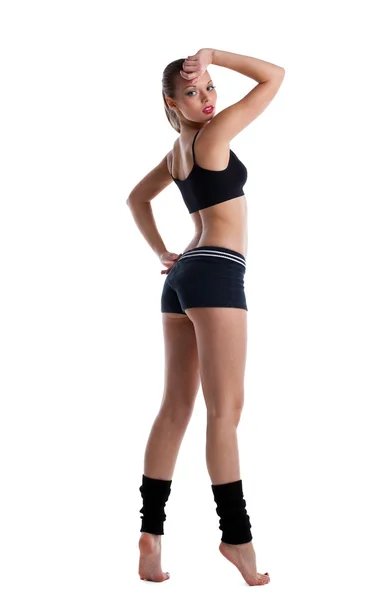 Glückliche junge Frau posiert im Fitness-Kostüm — Stockfoto