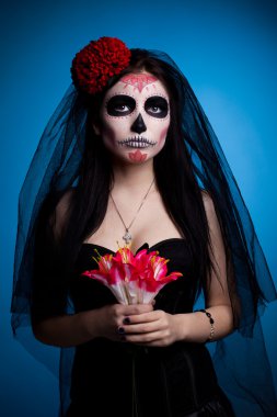 Serious woman in skull face art mask and flowers clipart