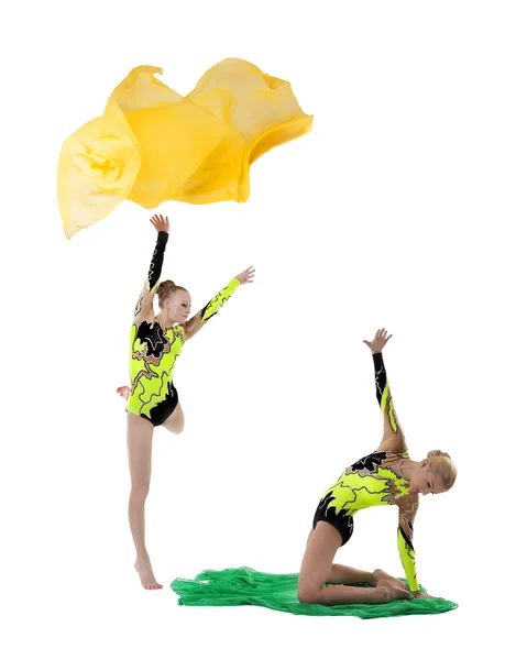 Two beauty gymnasts dance with flying fabric — Stock Photo, Image