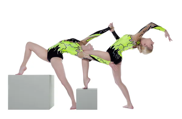 Two high skill woman as gymnast dance on cube — Stock Photo, Image