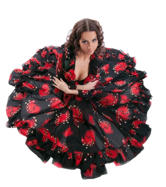Ung kvinna poserar i flamenco kostym isolerade — Stockfoto