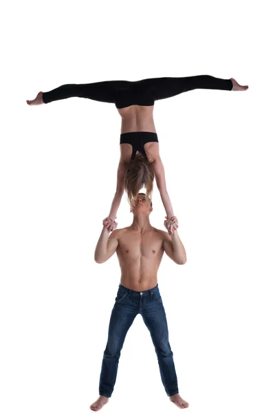 Pareja de gimnasta muestran stand en la mano —  Fotos de Stock