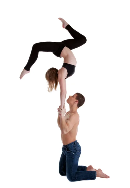 Two young acrobats show stand on hand — Stock Photo, Image